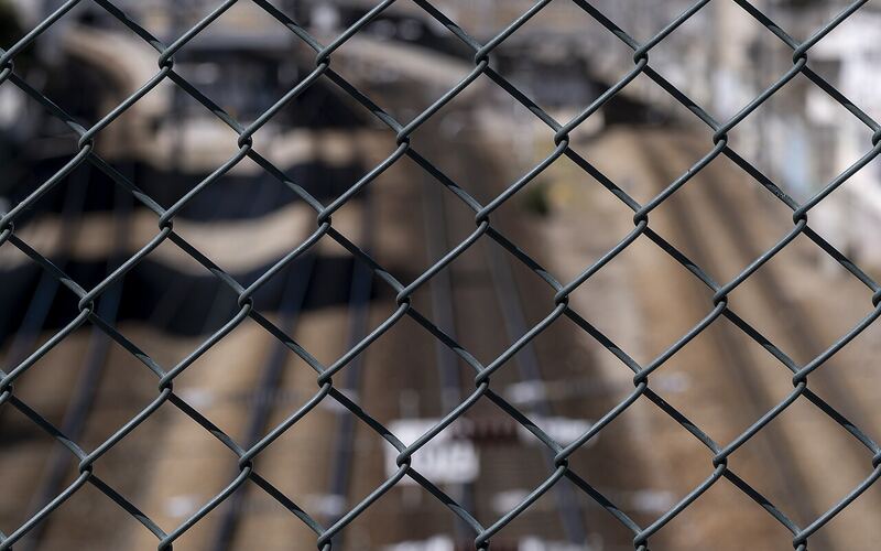Galvanized (GI) chainlink fence with silver diamond-pattern wire mesh